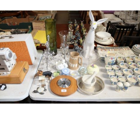 A quantity of various ornaments to include a white glazed hare, a pestle and mortar, a Victorian jug, glass vases etc.