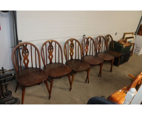 A set of six Ercol stick back dining chairs