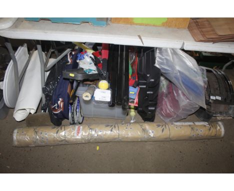 A roll of fabric; various sporting goods, tarpaulin etc.