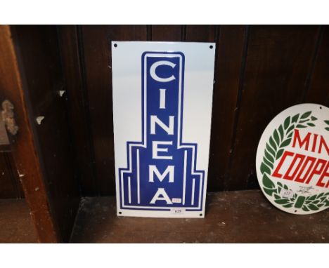 A reproduction enamel Cinema sign
