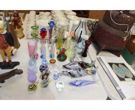 A collection of Murano type coloured glassware including fish ornaments, spill vases, paperweights etc. 