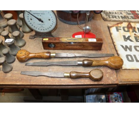 A spirit level by J Raybone & Sons together with three large vintage turned wooden handled screwdrivers by Clay of Sheffield