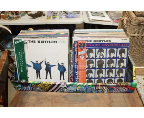 A box of various LP records including The Beatles