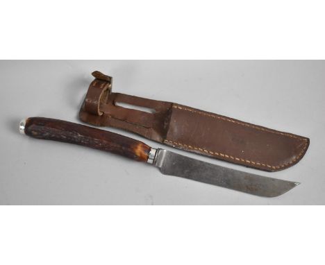 A Bone Handled Hunting Knife with Silver End Cap and Collar together with unrelated Leather Scabbard 