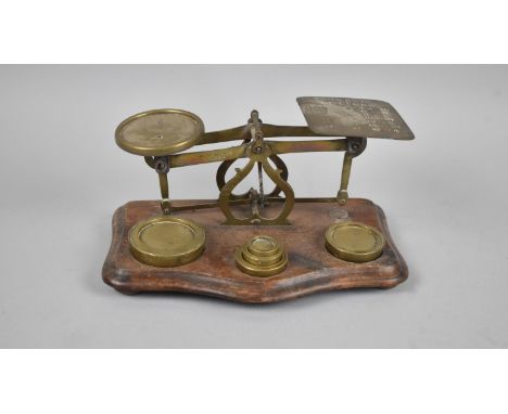 An Edwardian Brass Postage Scales by Wright and Co, Complete with Weights on Wooden Plinth Base, 20cms Wide 