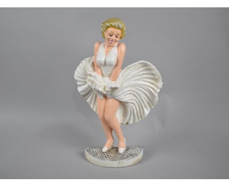 A Reproduction Cold Painted Cast Metal Door Stop in Form of Marilyn Monroe, 34cms High 