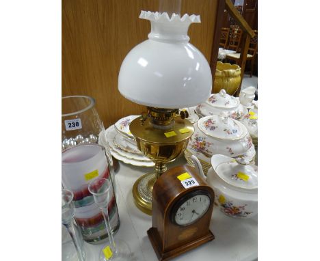 An inlaid Edwardian mantel clock & a brass based oil lamp