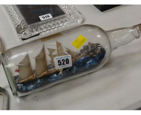 Vintage ship in bottle with inscription to the base outlining the ship
