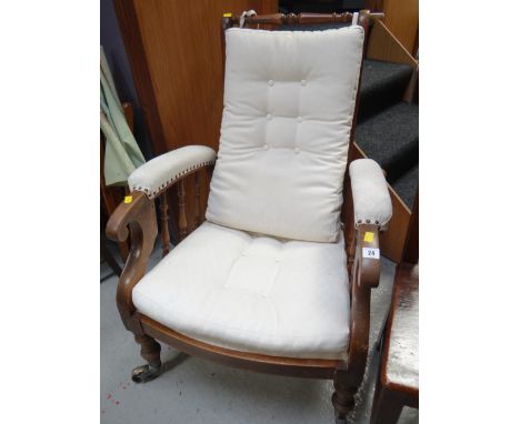 A semi-upholstered spindle sided vintage armchair