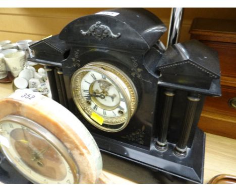 A nineteenth century American slate architectural mantel clock