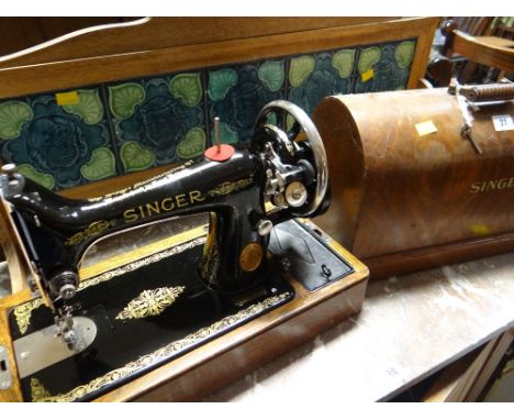 A vintage Singer sewing machine in case