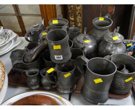 A quantity of pewter items including a shot flask, a court jug etc