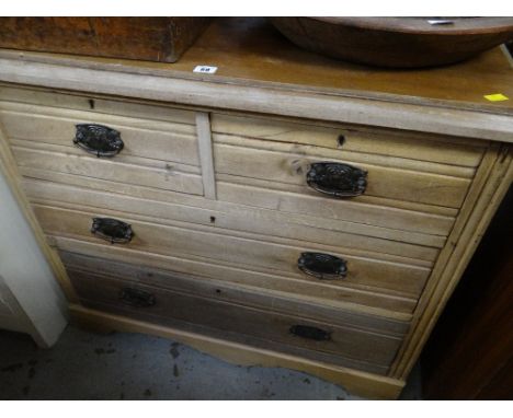 A lightwood vintage chest of two long & two short drawers