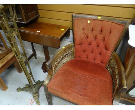 A vintage cane work & upholstered armchair together with a drop-flap occasional table