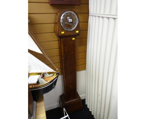 A vintage polished grandmother clock