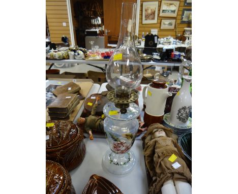 An unusual painted Vaseline glass oil lamp