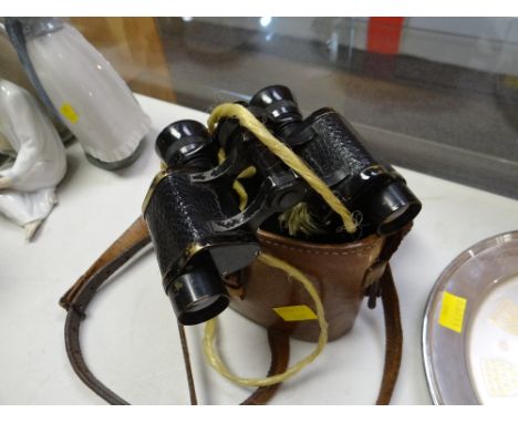 A cased set of vintage German binoculars in a monogrammed case