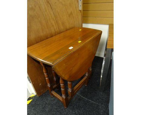 A neat light oak drop leaf gate-leg table