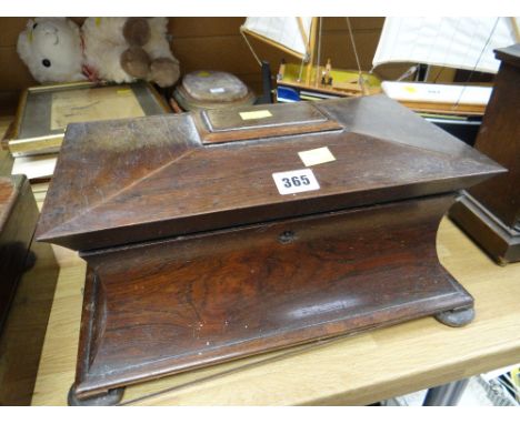 An early nineteenth century rosewood sarcophagus tea caddy (distressed)