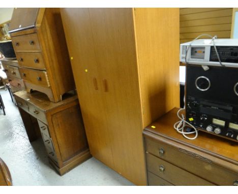 A vintage three-drawer chest, a two-door wardrobe, polished sloped front bureau