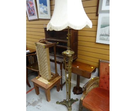 An elaborate tripod brass standard lamp & shade
