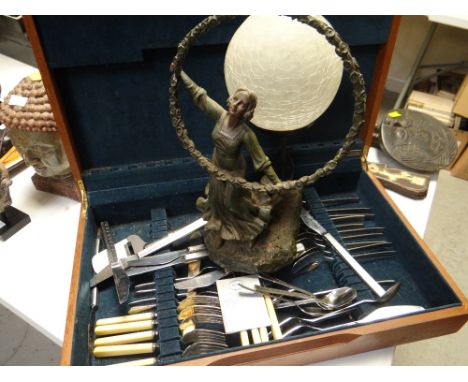 An Art Deco-style globular figural table lamp & a part cutlery set in a case