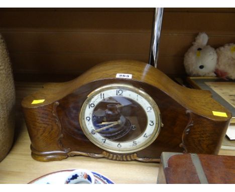 A 1930s polished mantel clock