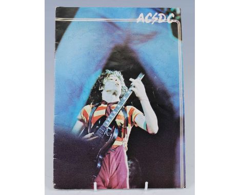 AC/DC, a concert programme from the "Dirty Deeds Done Cheap" 1977 U.K. tour, signed to the cover in blue biro by band members