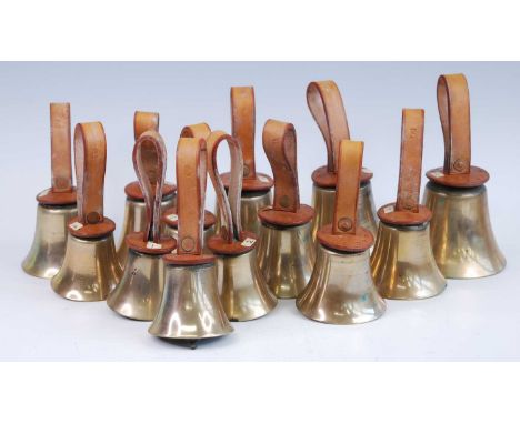 Camponology, a set of thirteen musical hand bells, each with a leather collar and handle stamped with keynotes, largest dia.1