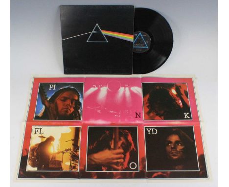 A collection of LP's to include Pink Floyd - The Dark Side Of The Moon (two posters, no stickers), Status Quo - Down The Dust