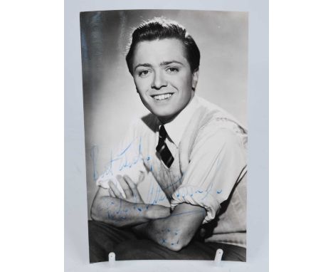 A collection of mid-20th century promotional portrait photographs and postcards of various stage and screen stars, some hand 