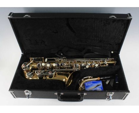 A Schwarzschild Super Sax alto saxophone, with A Tune A Day For Saxophone Book One in fitted carry case.Three mother of pearl