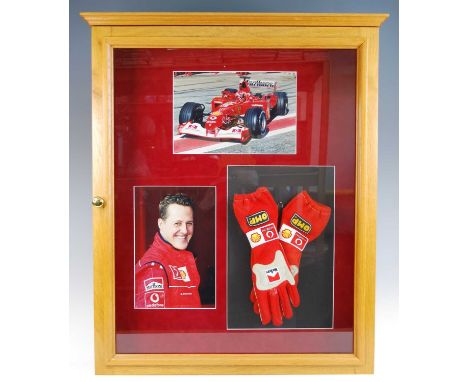 Formula 1, a pair of OMP Racing Gloves, with sponsorship badges for Marlboro and Vodaphone, signed by Michael Schumacher in b