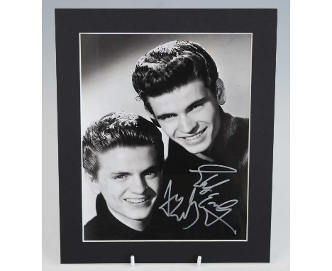 The Everly Brothers, a 25 x 20cm black and white portrait photograph, signed by both Don and Phil in silver ink, with Autogra