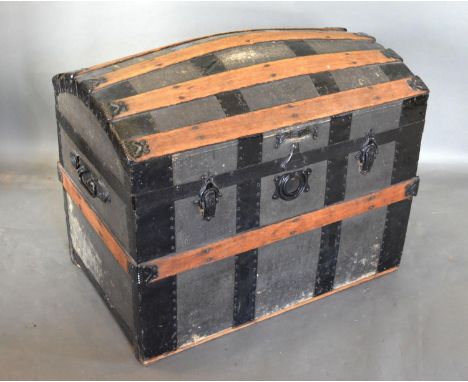 An Early 20th Century Banded Trunk with end handles, 72 cms wide, 47 cms deep, 56 cms high 