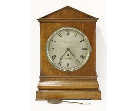 An oak bracket clock,19th century, in an architechtural case, the silvered dial inscribed 'Barraud and Lunds, 49 Cornhill, Lo