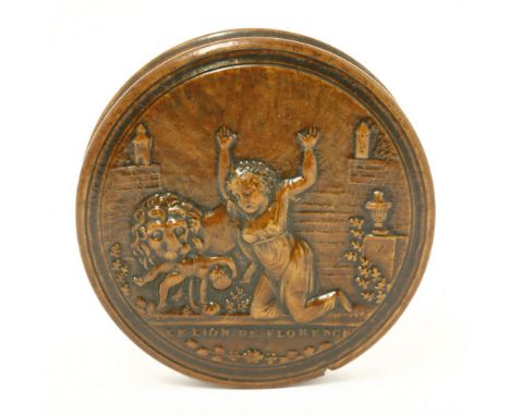 A French pressed wood circular snuff box,19th century, with relief decoration titled 'Le Lion de Florence',8.7cm diameter (2)