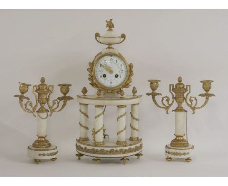 A French alabaster and gilt metal mounted clock garniture,the painted enamel dial with floral garlands, with a drum movement 