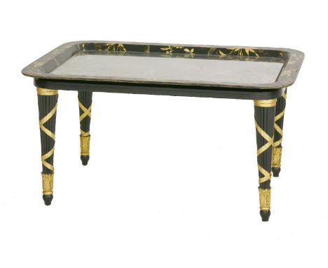 A Victorian papier mâché tray,painted with a Chinese landscape within gilt foliage, on a later painted stand,78cm long59cm wi