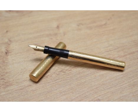 A Mabie Todd &amp; Co Swan Lady eye dropper fountain pen in engine turned yellow metal having Swan 2 14Ct Mabie Todd &amp; Co