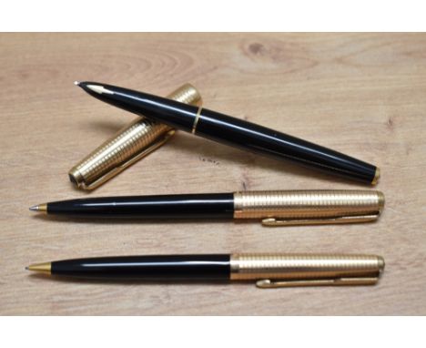 A Parker 61 Custom Insignia capillary fill fountain pen, ballpoint pen and propelling pencil set in black with rolled gold ca