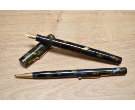 A Mabie Todd &amp; Co Swan SM2/58 lever fill fountain pen and propelling pencil set in green, gold and black marble with sing