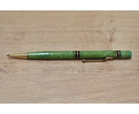 A Mabie Todd Swan propelling pencil with two gold on black band (142/50) in jade green