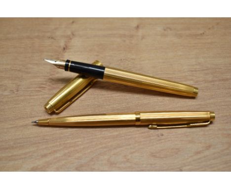 A Parker 75 Godron aerometric fill fountain pen and propelling pencil set in rolled gold.