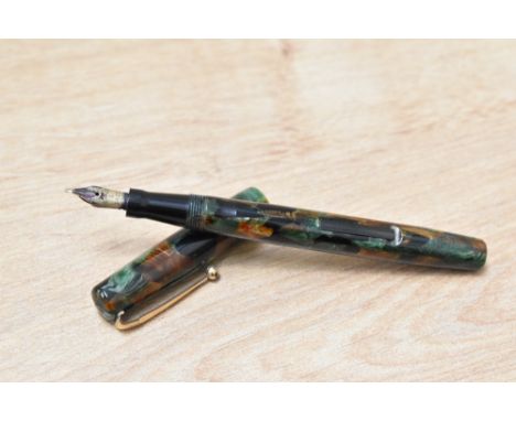 A Mabie Todd &amp; Co Swan SM100/63 self Filler lever fill fountain pen in Russet and Jade having Swan 1 14Ct Mabie Todd &amp