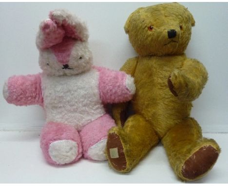 A large 1950's Chad Valley jointed Teddy bear with growler, 68cm tall and a large pink and white stuffed rabbit, c.1950's/196