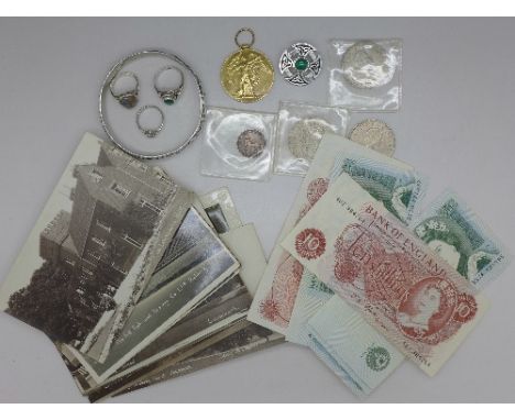 A pewter bangle, two silver rings, a brooch, coins including 1866 farthing, postcards of Letchworth and surrounding area, two