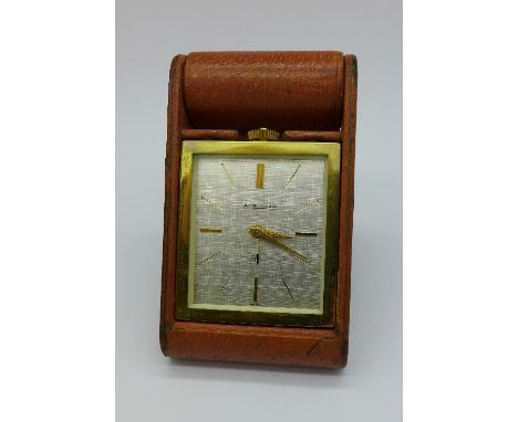 A Jaeger LeCoultre 8 Days travel alarm clock, with gilt monogram dated '63