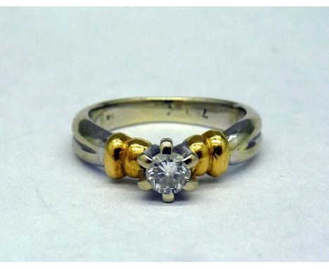 An 18ct white and yellow gold, diamond solitaire ring, weight 5.7g, size M