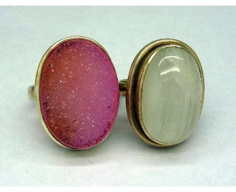 A pink druzy ring and a white metal and silver quartz ring